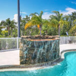 Pool with rock face waterfall.